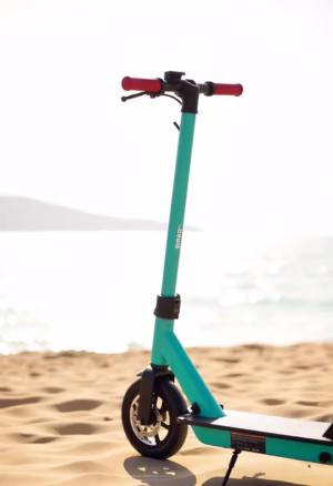 Electric scooter on a coastal road by the sea, representing electric bike rental services.